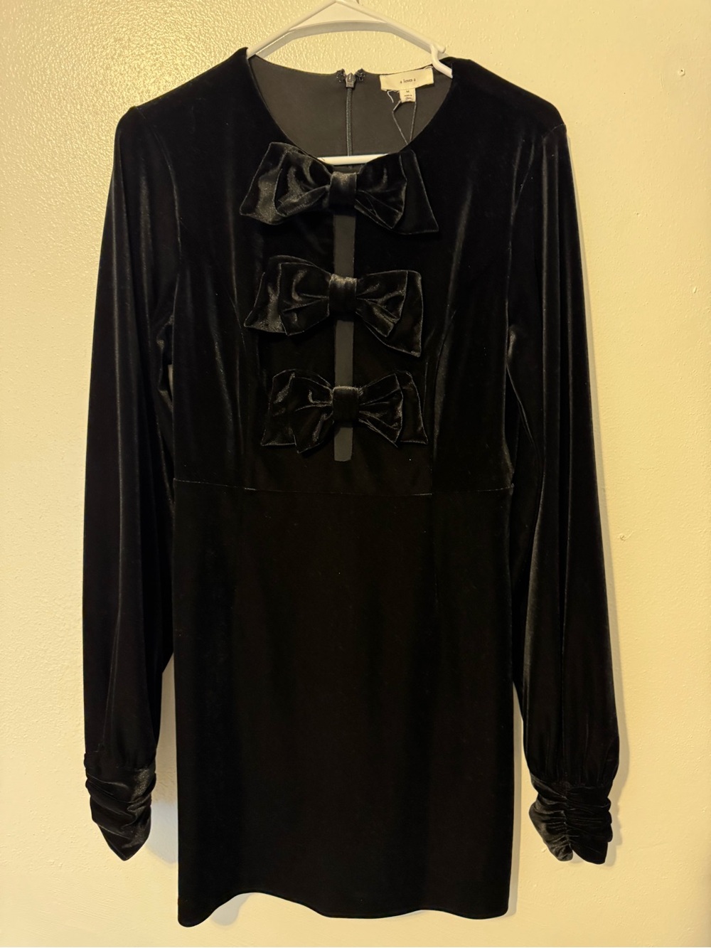 A Loves A Black Velvet Mini Dress with Front Bow Accents